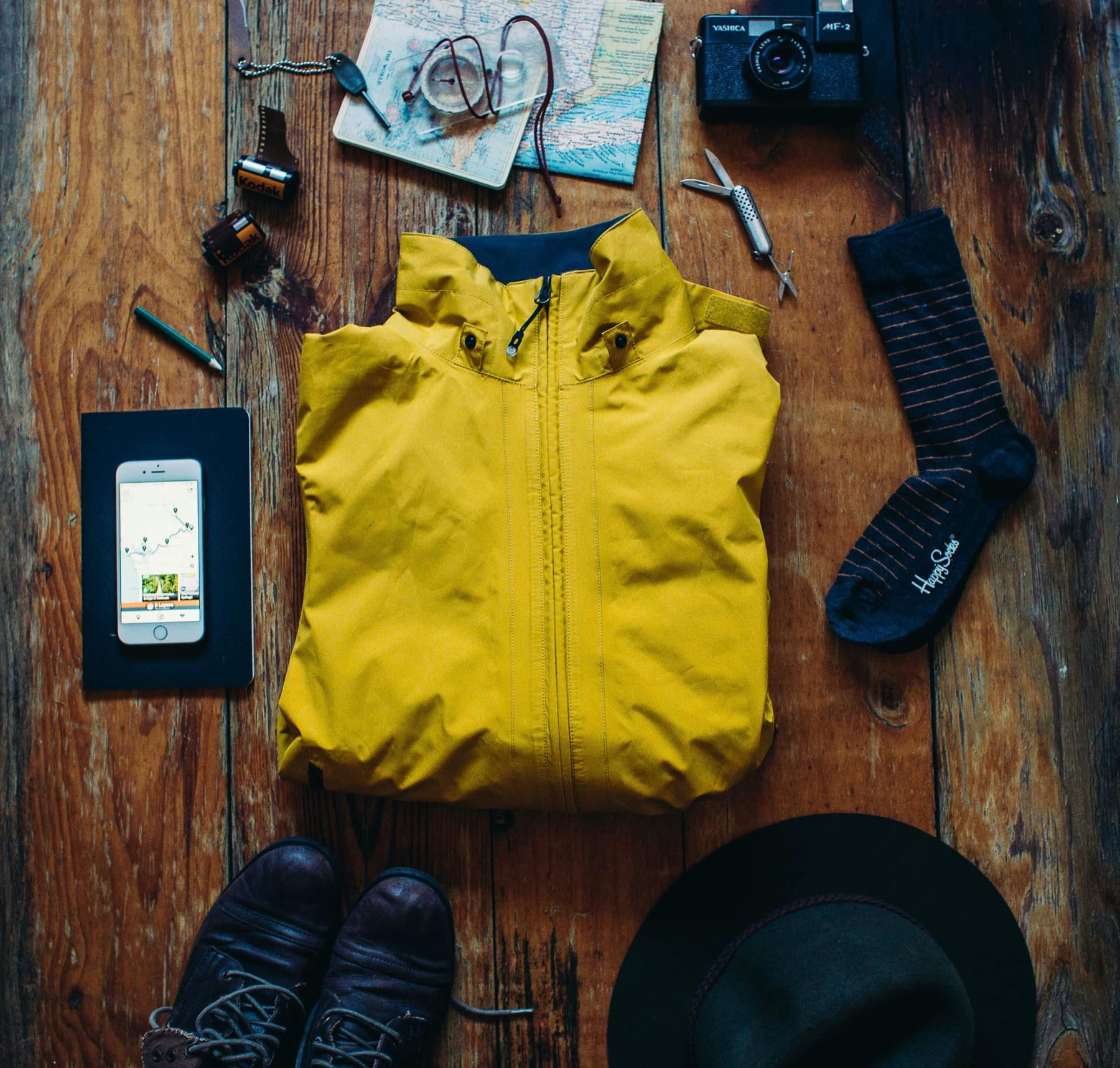 Trail-day kit flatlay with bottle and rations.