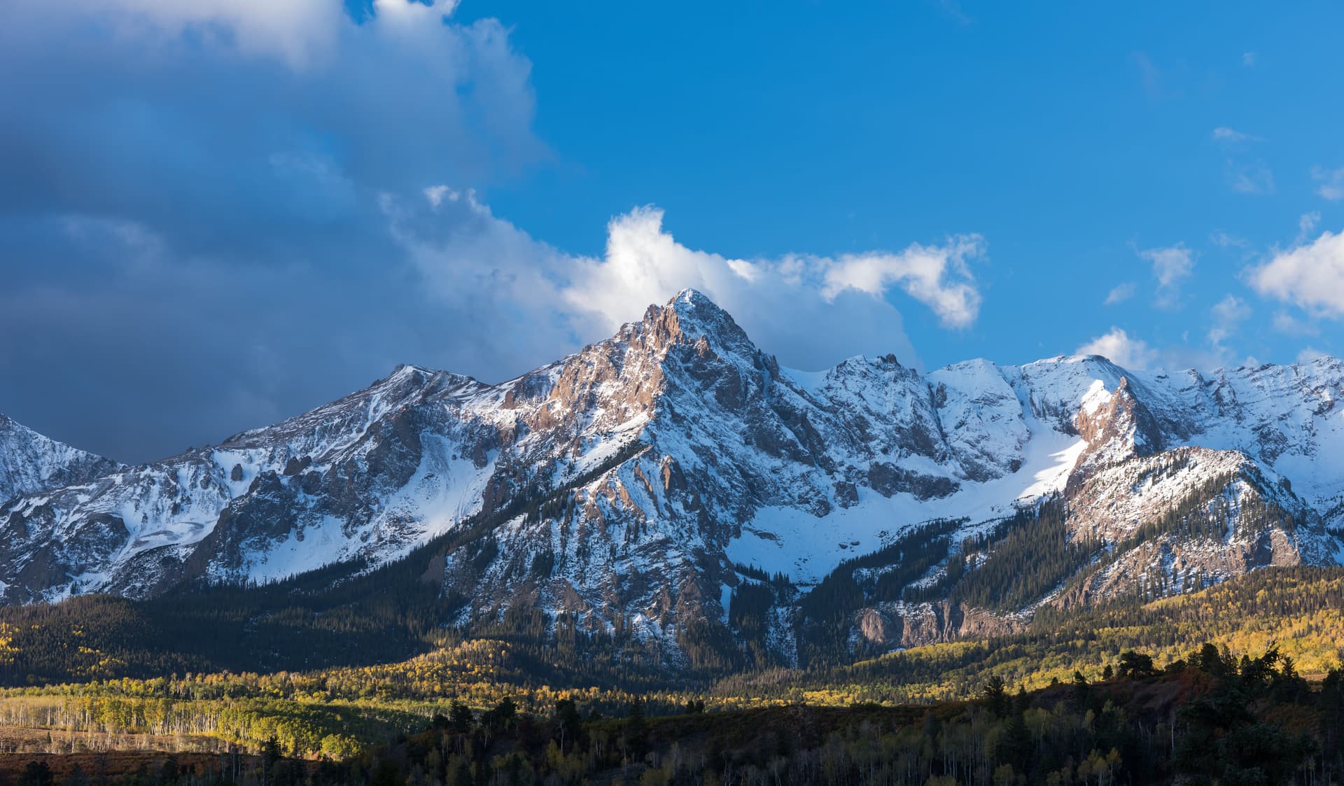 Late-afternoon storm clearing across Mount Sneffels in the San Juan range.